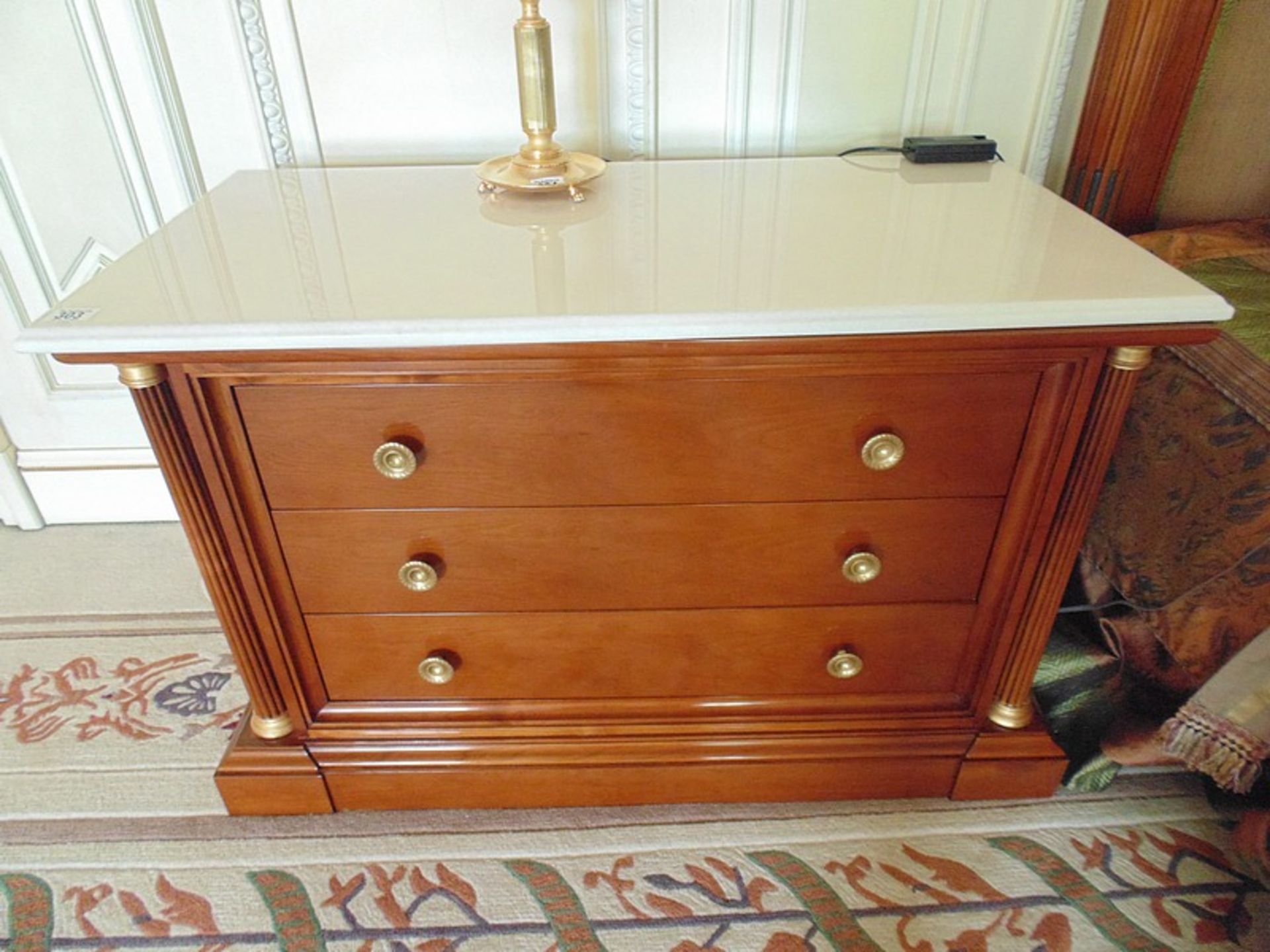 A pair of Empire style chest of drawers, a marble top above four drawer chest flanked by columns