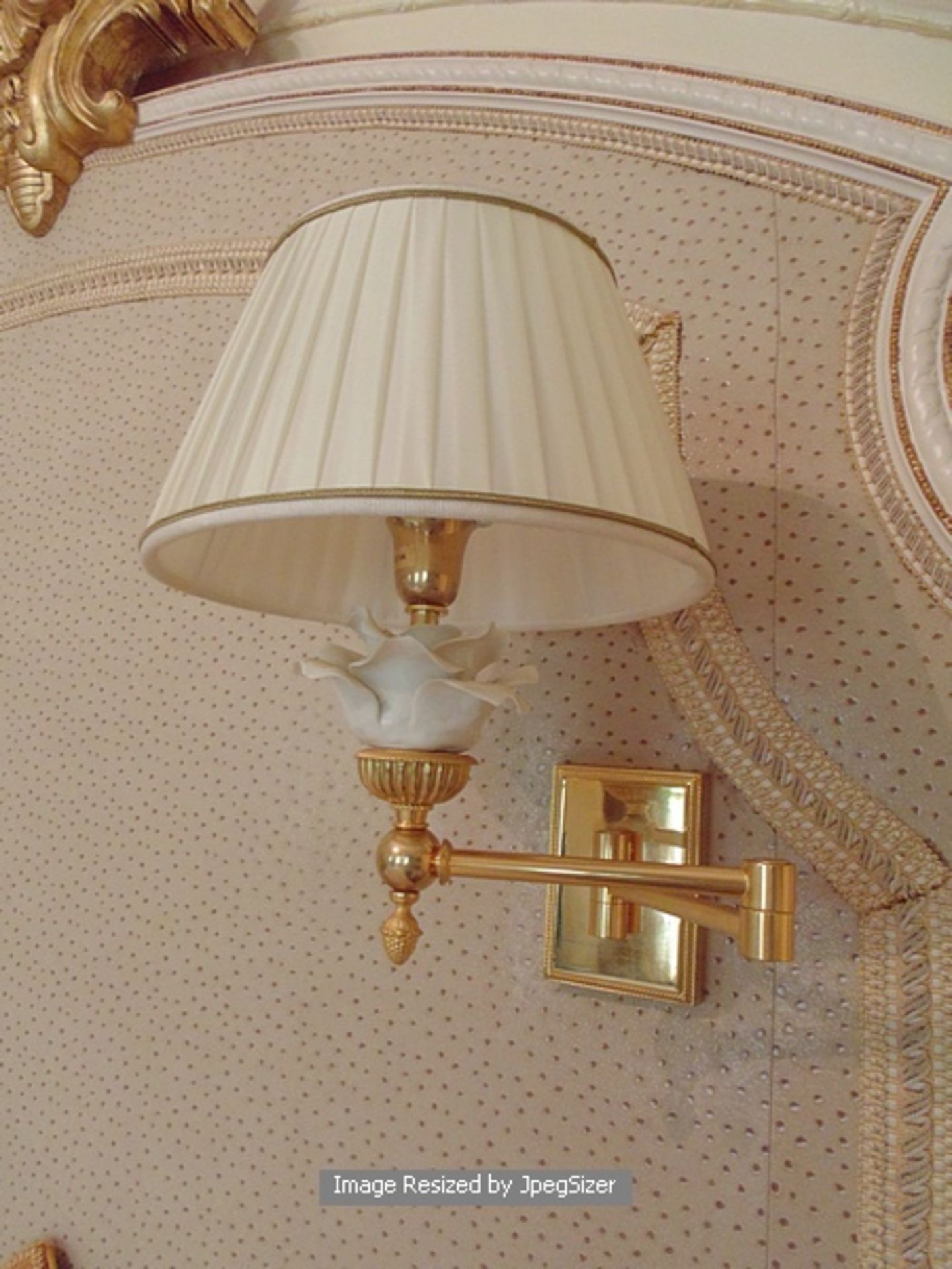 A pair of Laudarte T420 cantilever wall sconces bronze castings, with Capodimonte roses in white