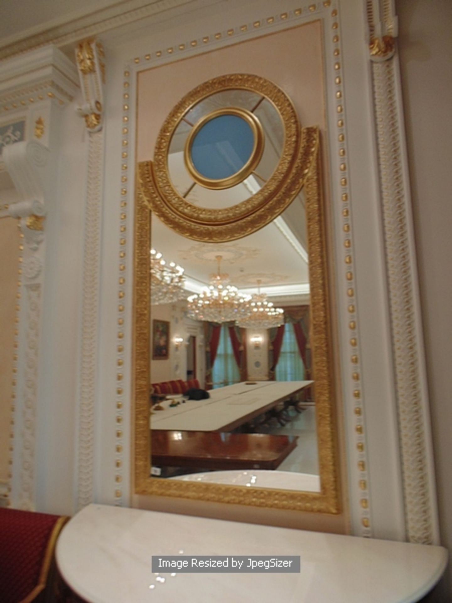 A neoclassical style carved and gilded mirror, a two part mirror with the main frame of the mirror - Image 2 of 2