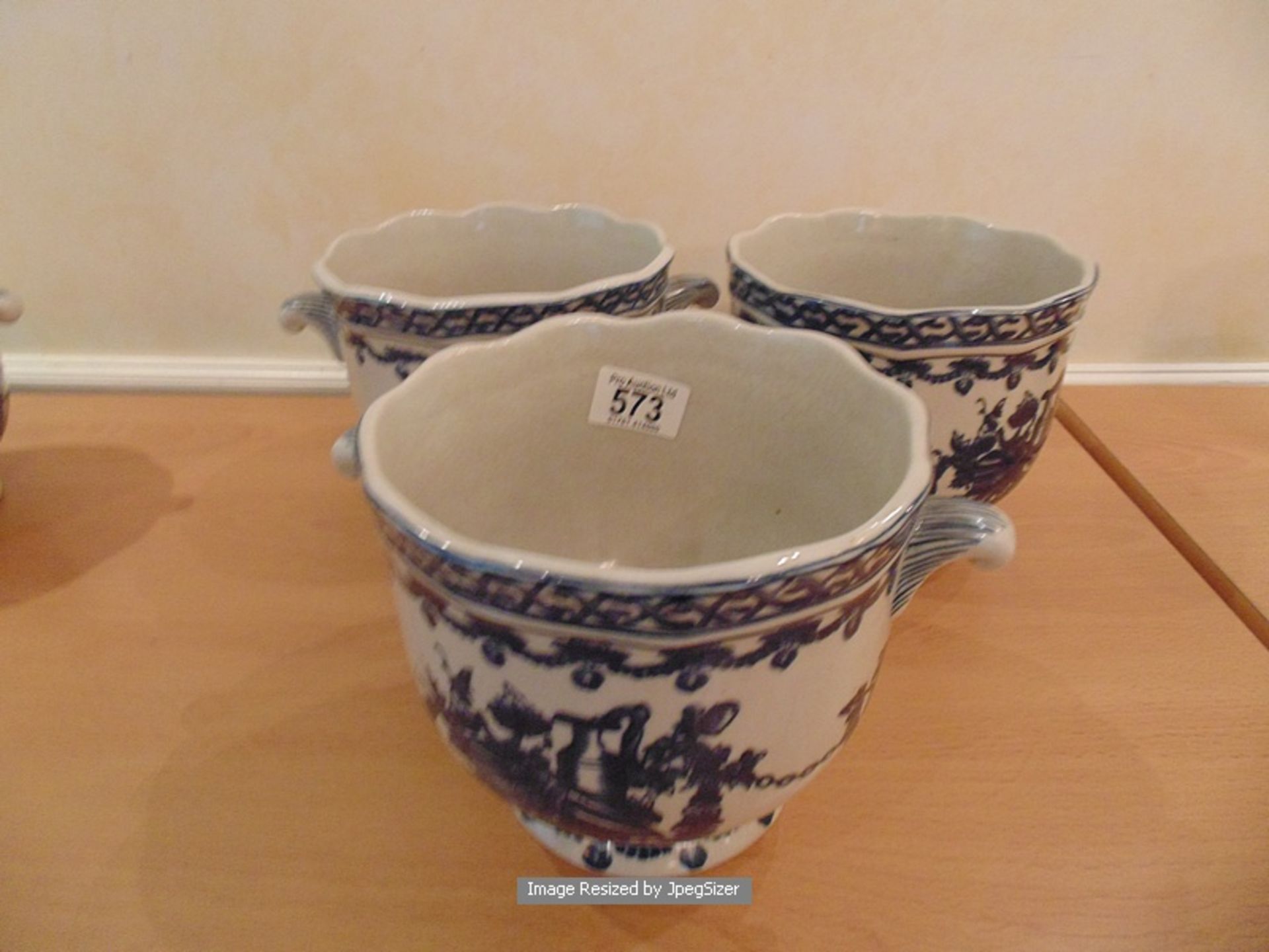 A set of three blue and white crackleware pots 150mm tall