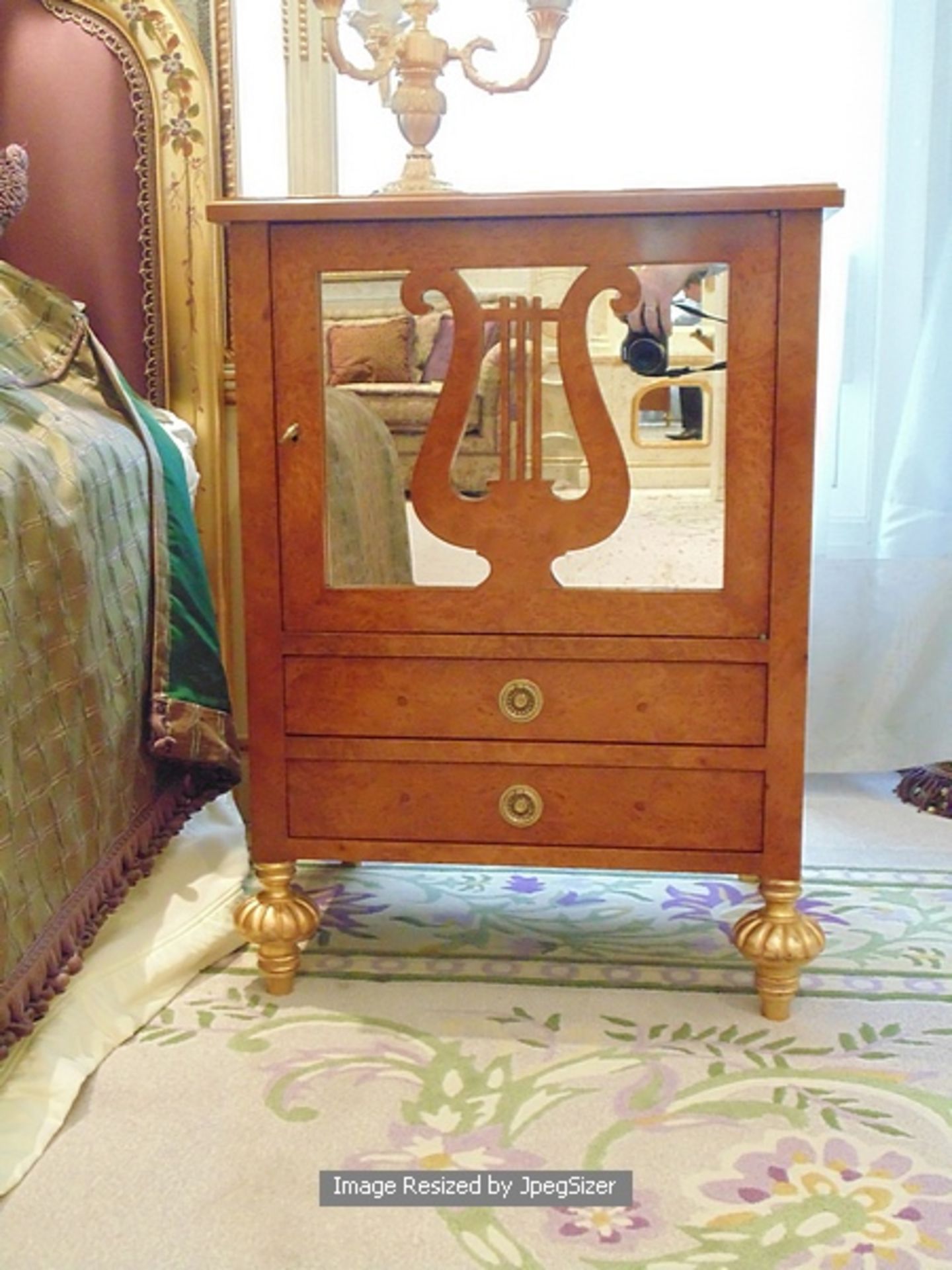 A pair of Neoclassical style bedside cabinets, a single glass cupboard with a carved lyre mount over