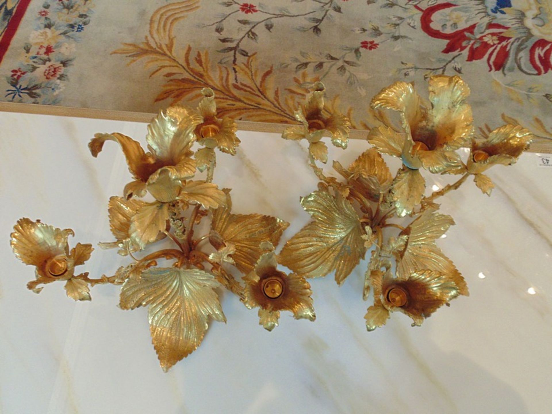 A pair of bronze with applied 24ct. gold leaf four branch candelabras in the form of a flower - Image 3 of 4