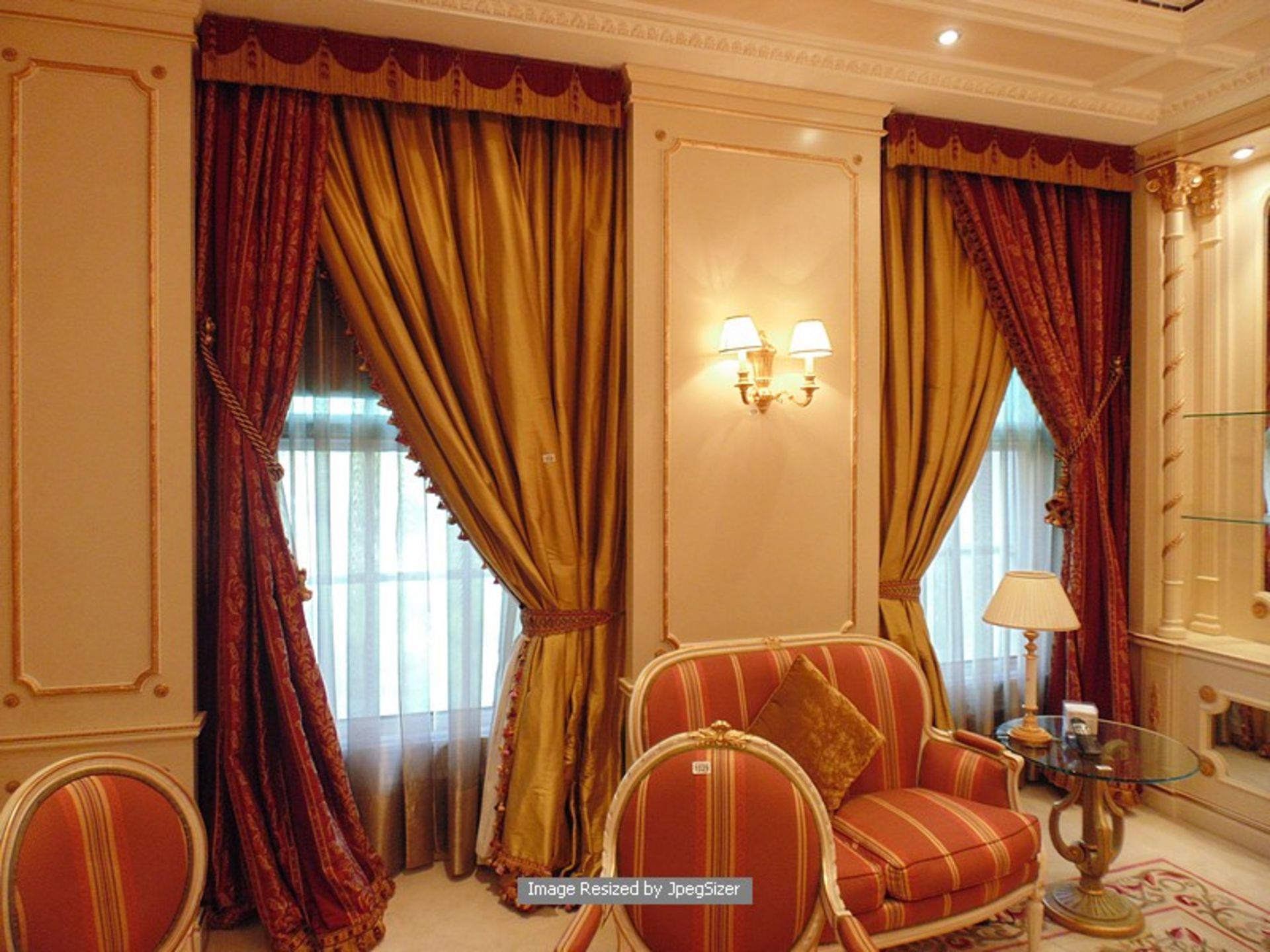 A set of two asymmetrical curtains of bronze gold curtains supplied by Jacquard from Rudolph