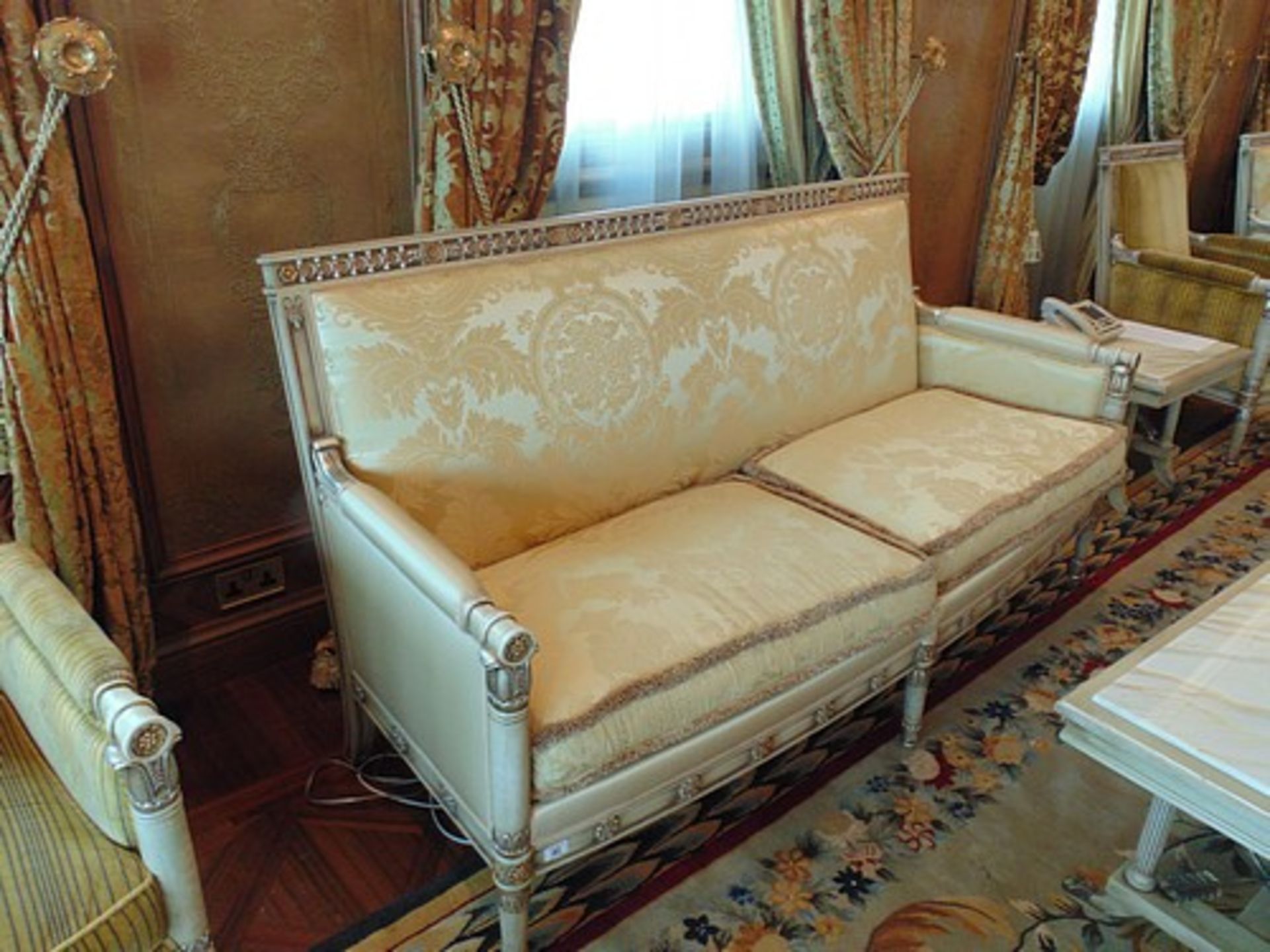 French Directoire Style Settee the rectilinear back has gilded foliage relief and the sides