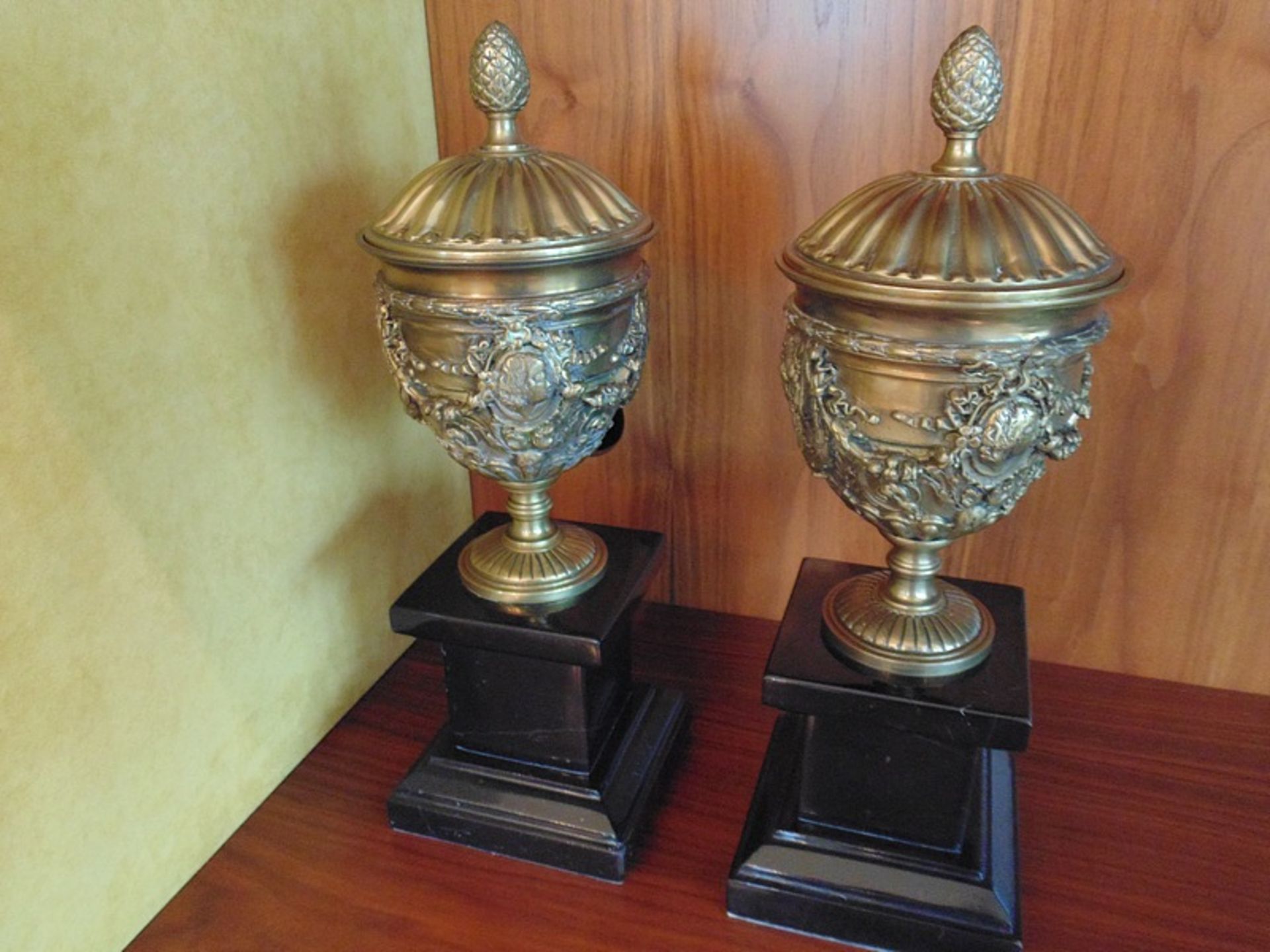 A pair of Italian Neoclassical gilt bronze urns cast in relief mounted on a black marble plinth - Image 2 of 3