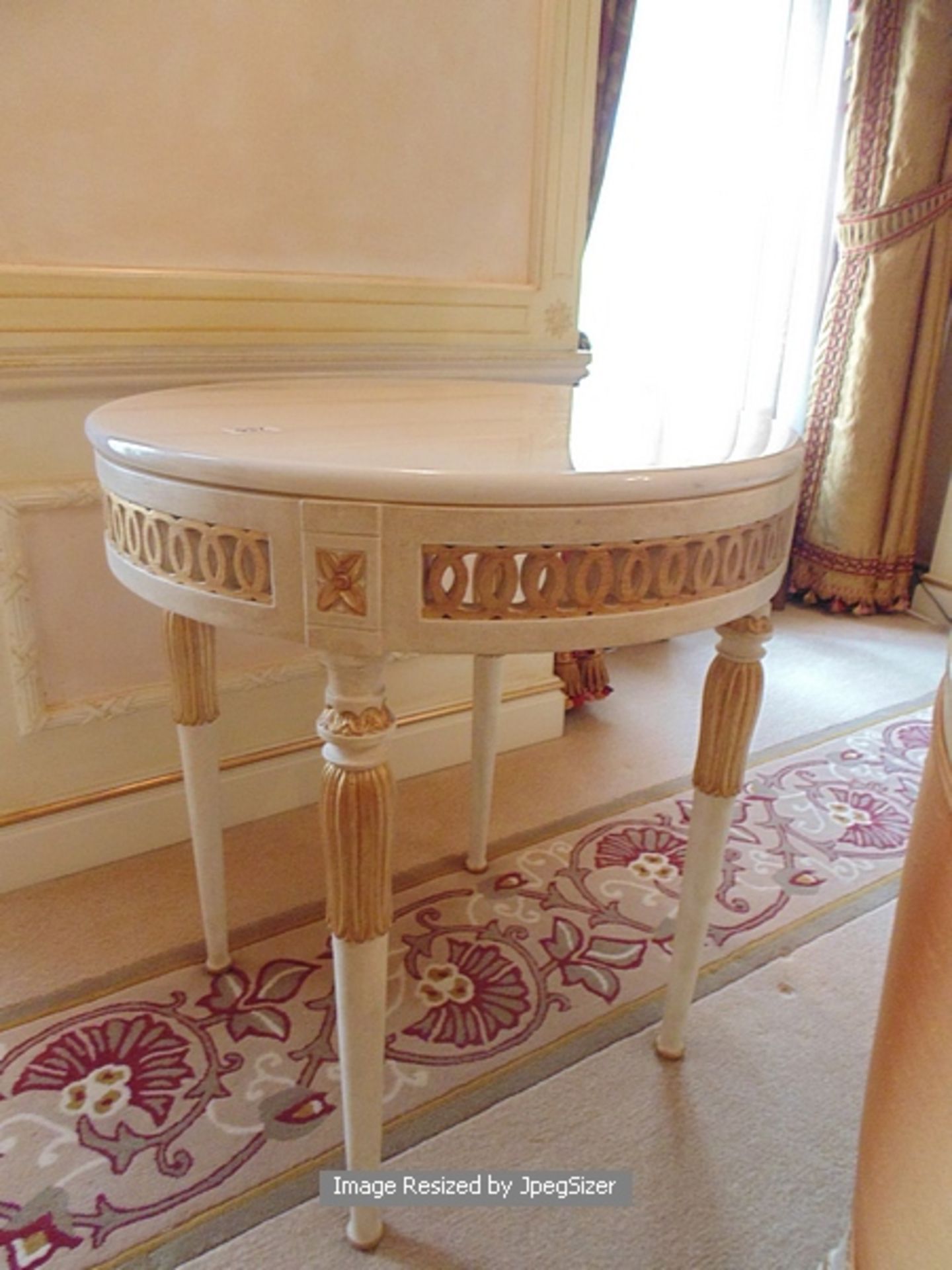 A neoclassical style French parcel gilt and painted occasional table having inset marble top with