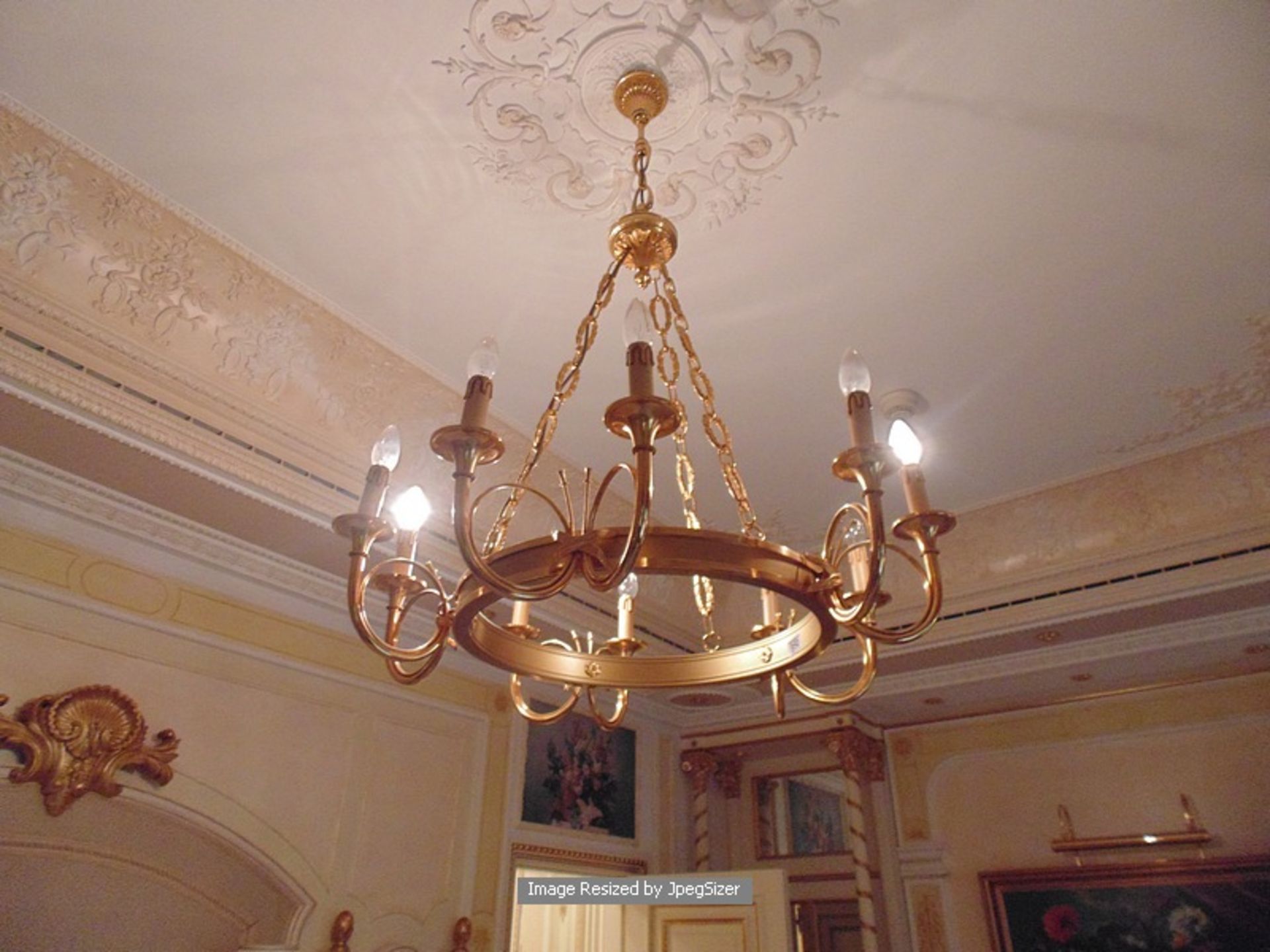 A bronze open frame 10 arm chandelier open candle style with ceiling chain 1040mm drop