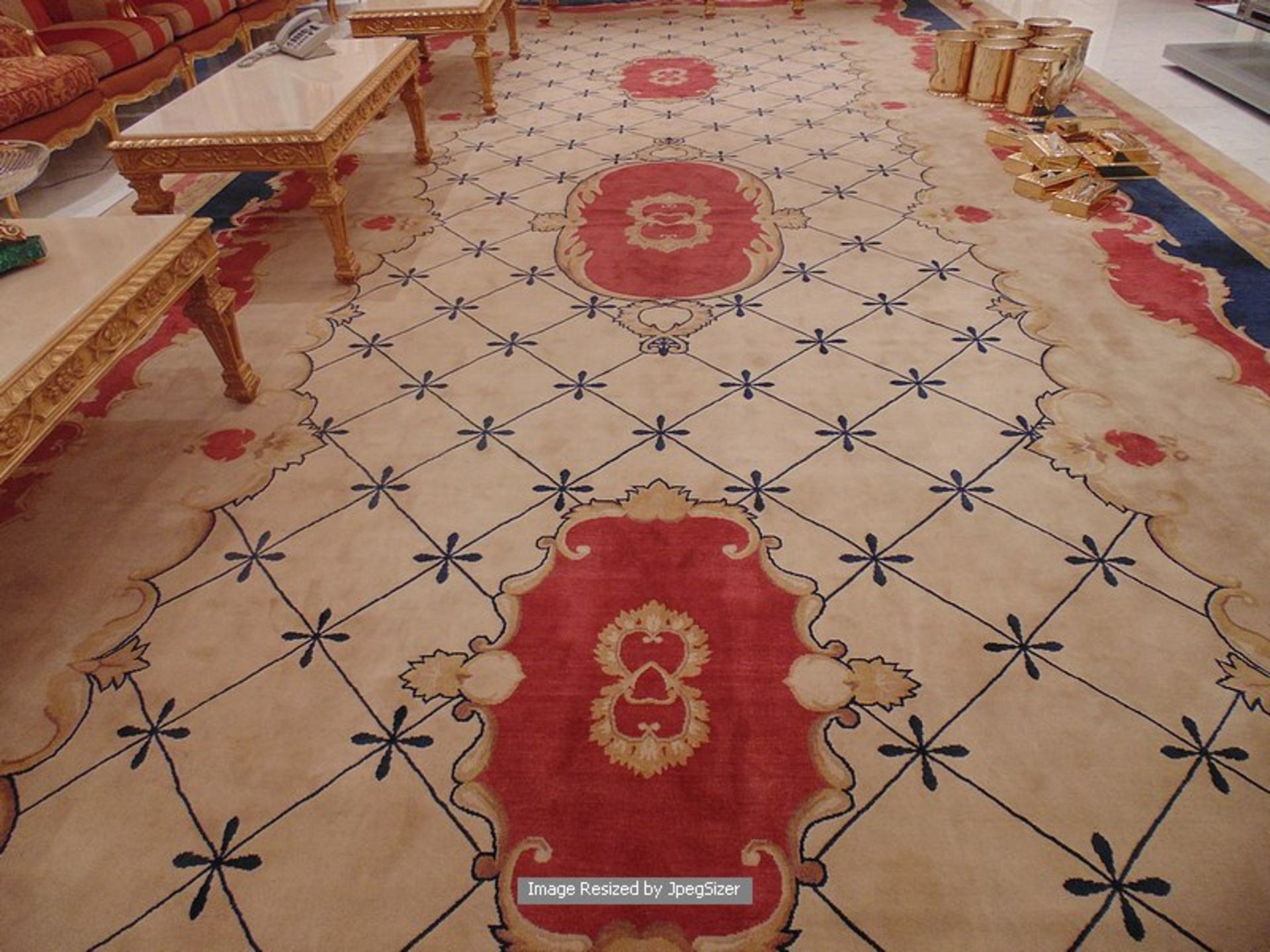 A sumptuous 100% pure new wool carpet 9.5mm x 4.4m cream field classic repeating pattern with