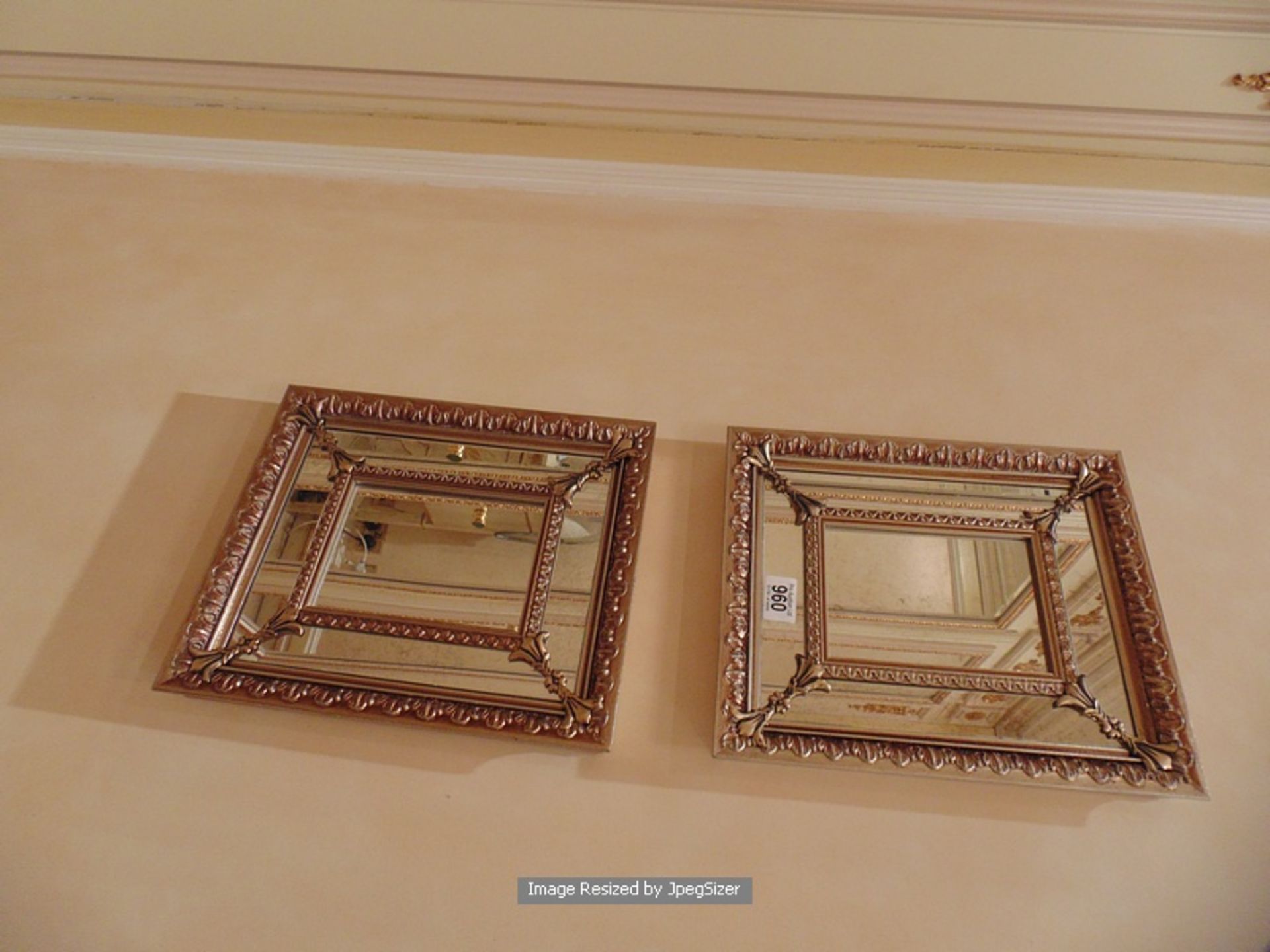 A pair of ornate framed small mirrors 290mm x 340mm