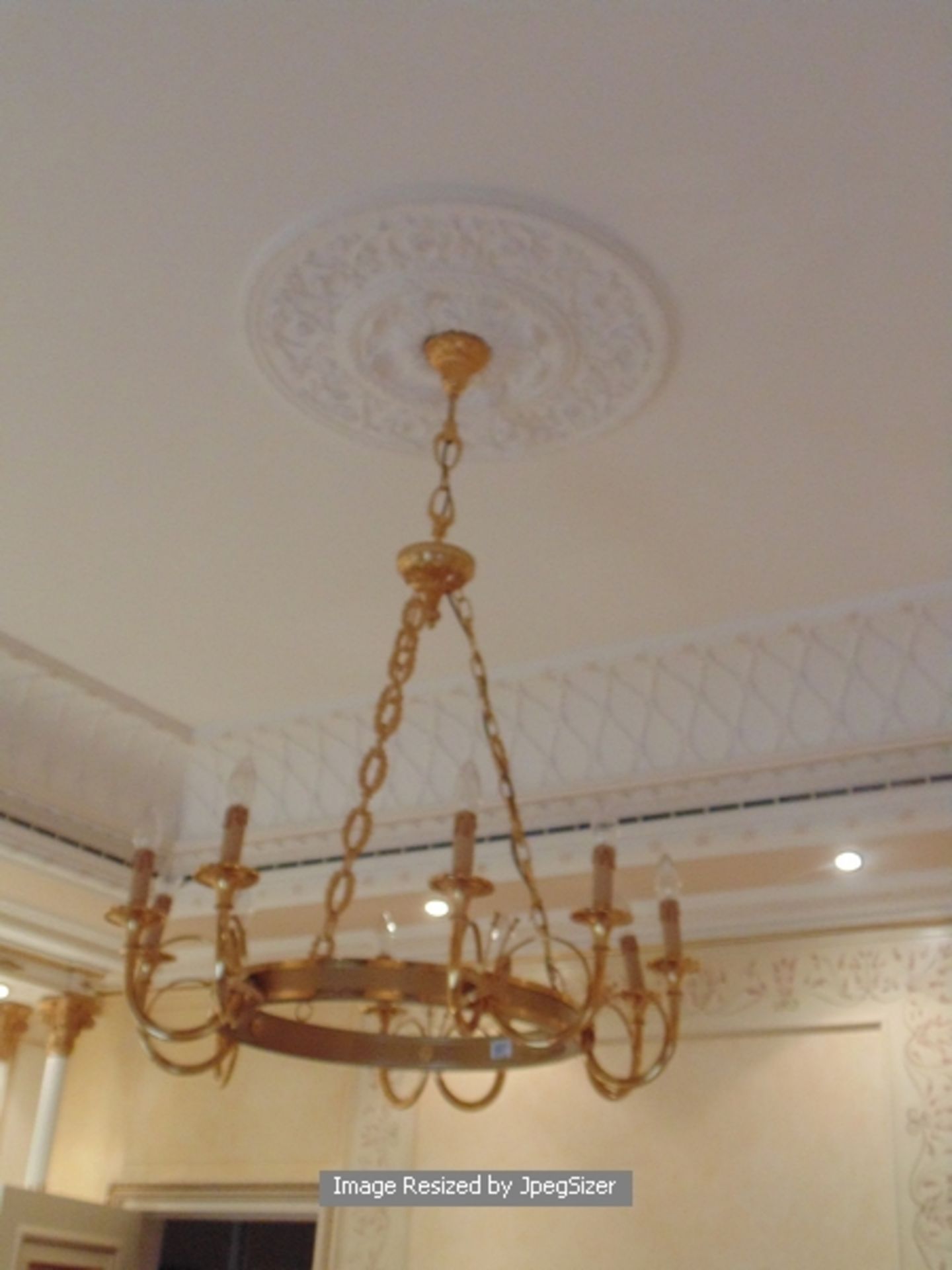A bronze 10 arm suspended chandelier with open bronze frame 1200mm drop