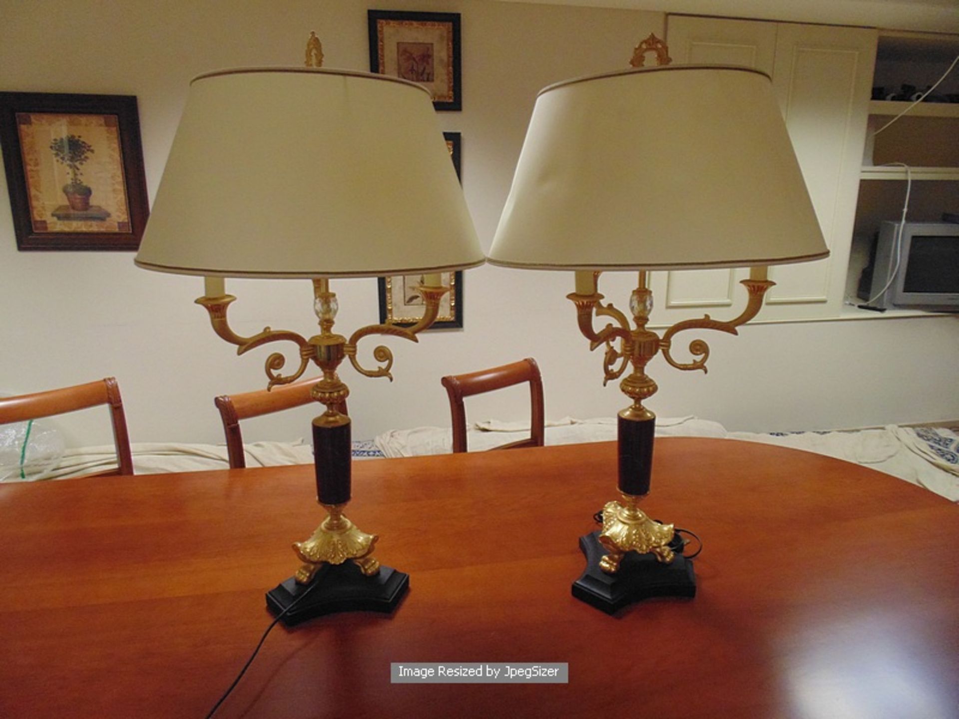 A pair of Laudarte Cariti table lamps, bronze castings, central column in black marble, and