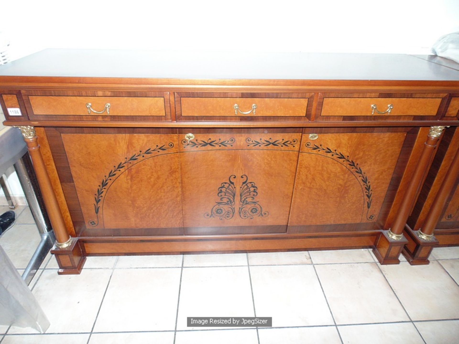 A flame mahogany sideboard in the French Empire style, with fluted quiver terminals, the straight - Image 2 of 5