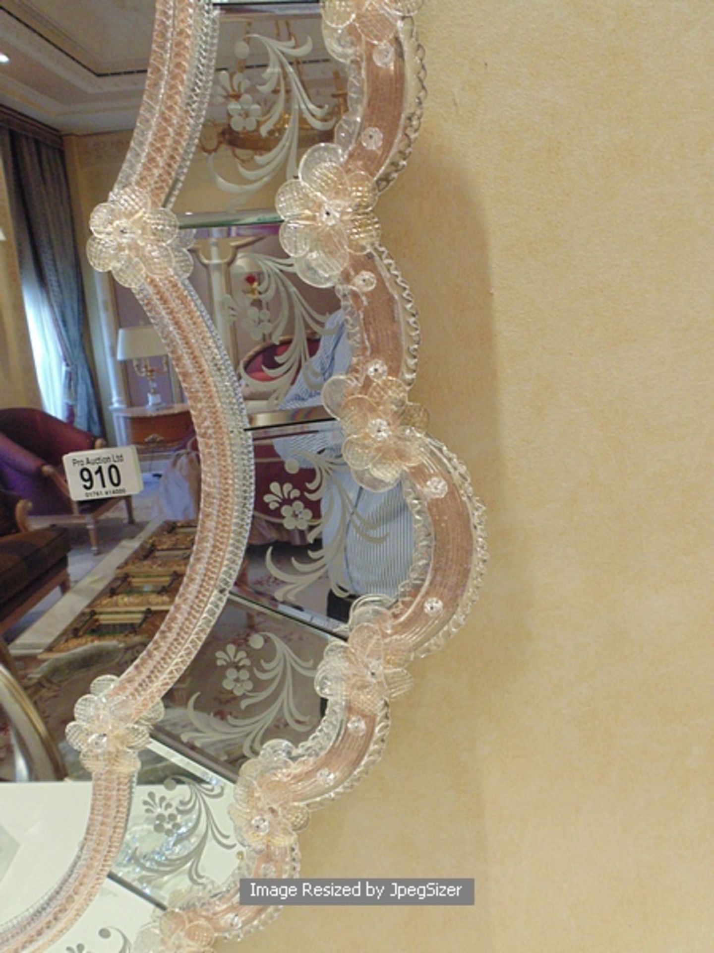 A Venetian oval shaped looking glass mirror in the eighteenth century style, the coloured glass