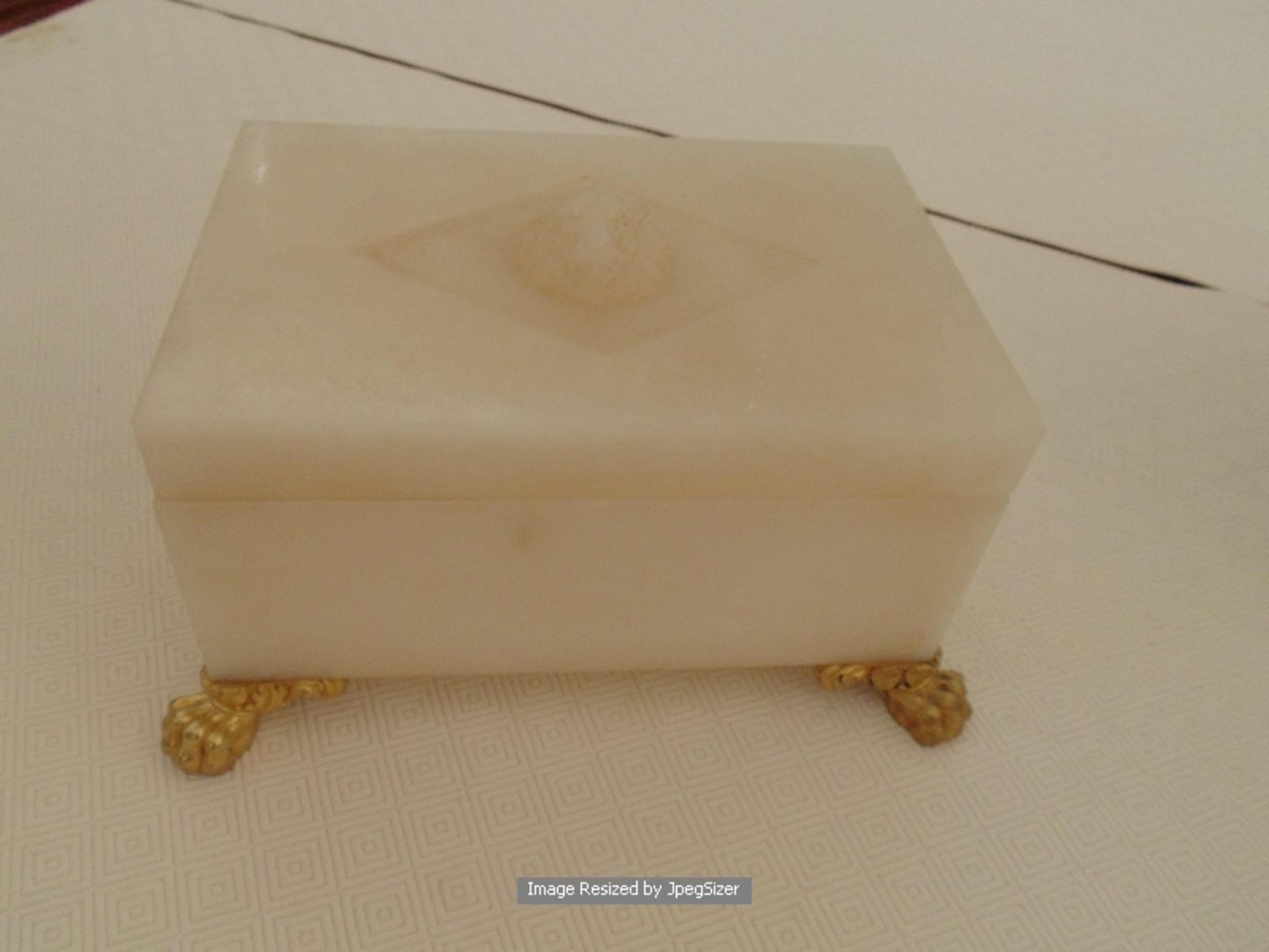 A fine carved alabaster and Dore bronze objet d'art piece, a carved lidded box chest mounted on four