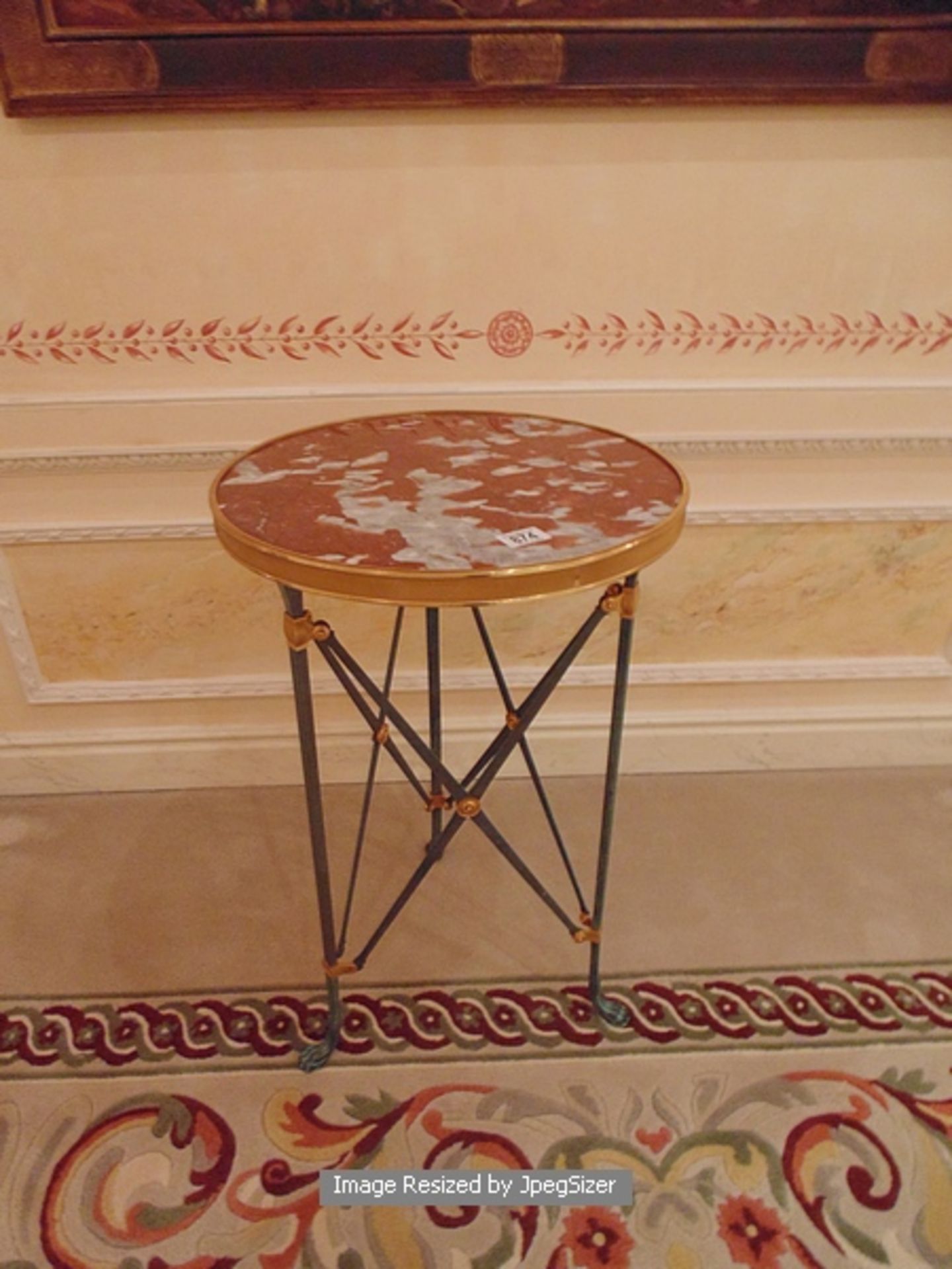 Neoclassical bronze gueridon table with inset marble tops, raised on straight legs and animal paw