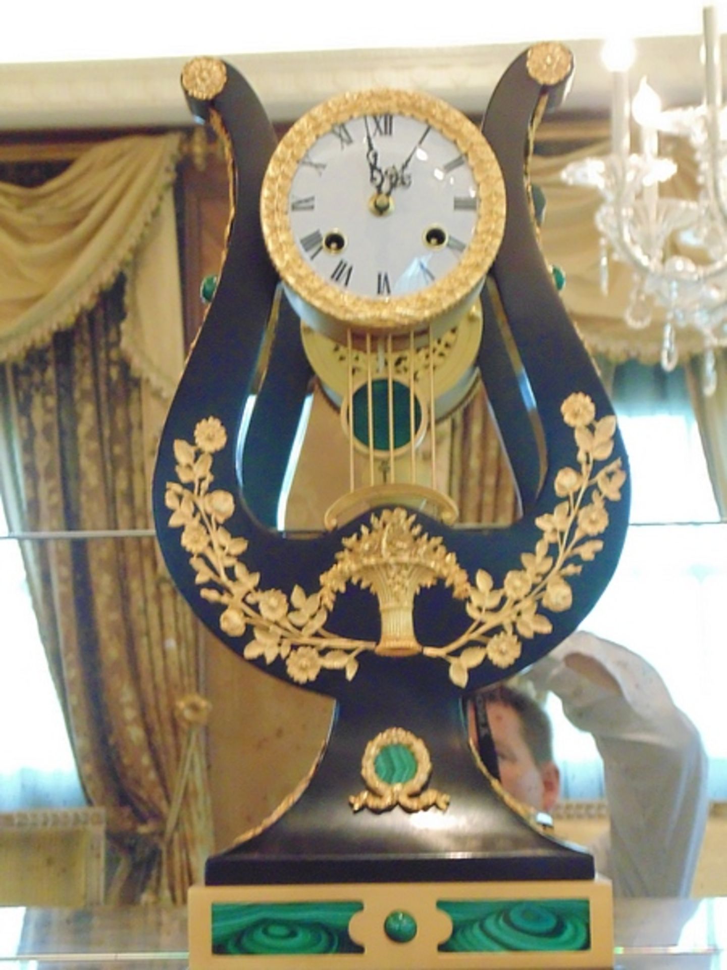 French style mounted lyre clock, ebonized hard wood with applied beaded borders and flowering