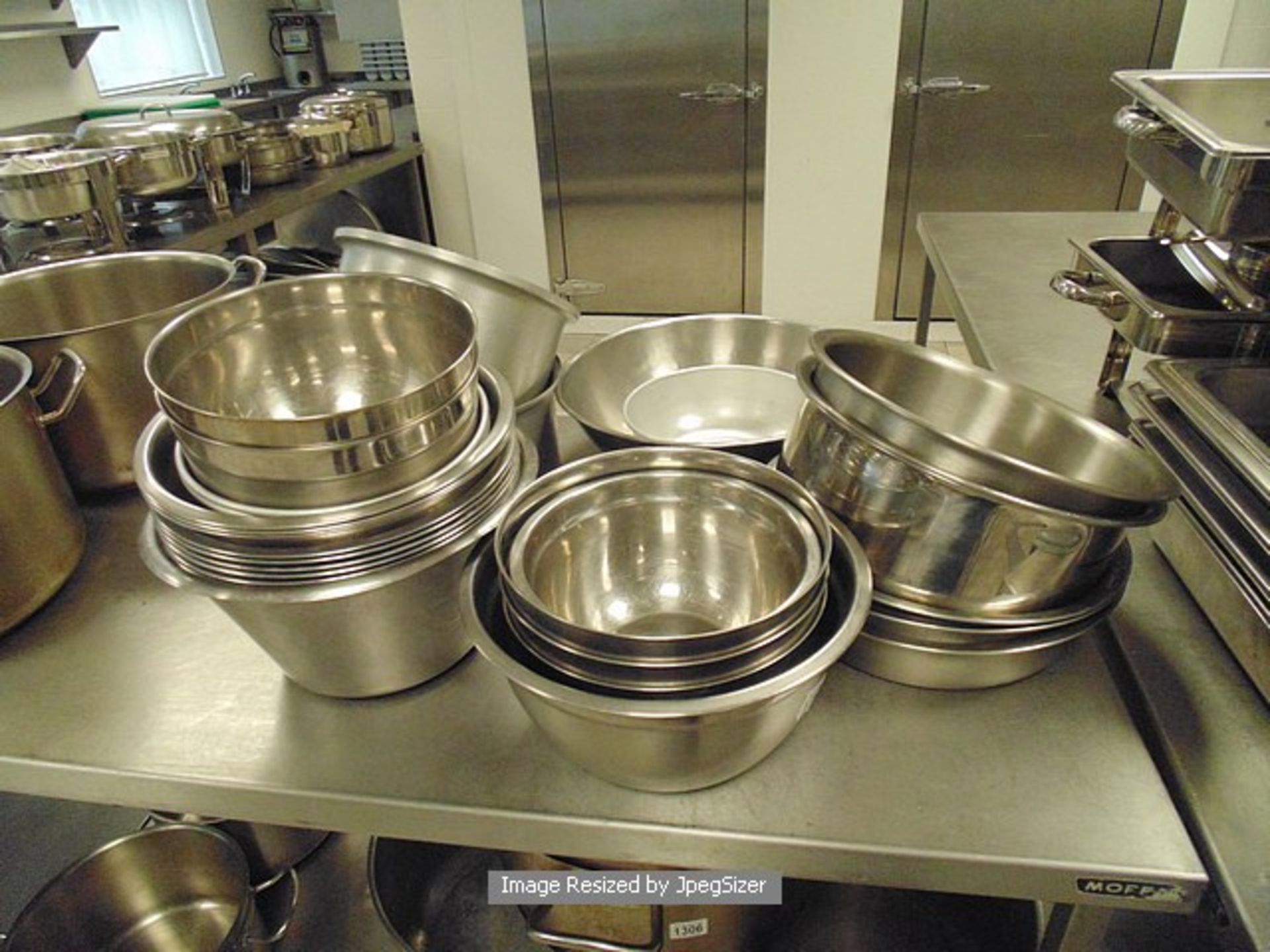 Large quantity of various mixing bowls as found
