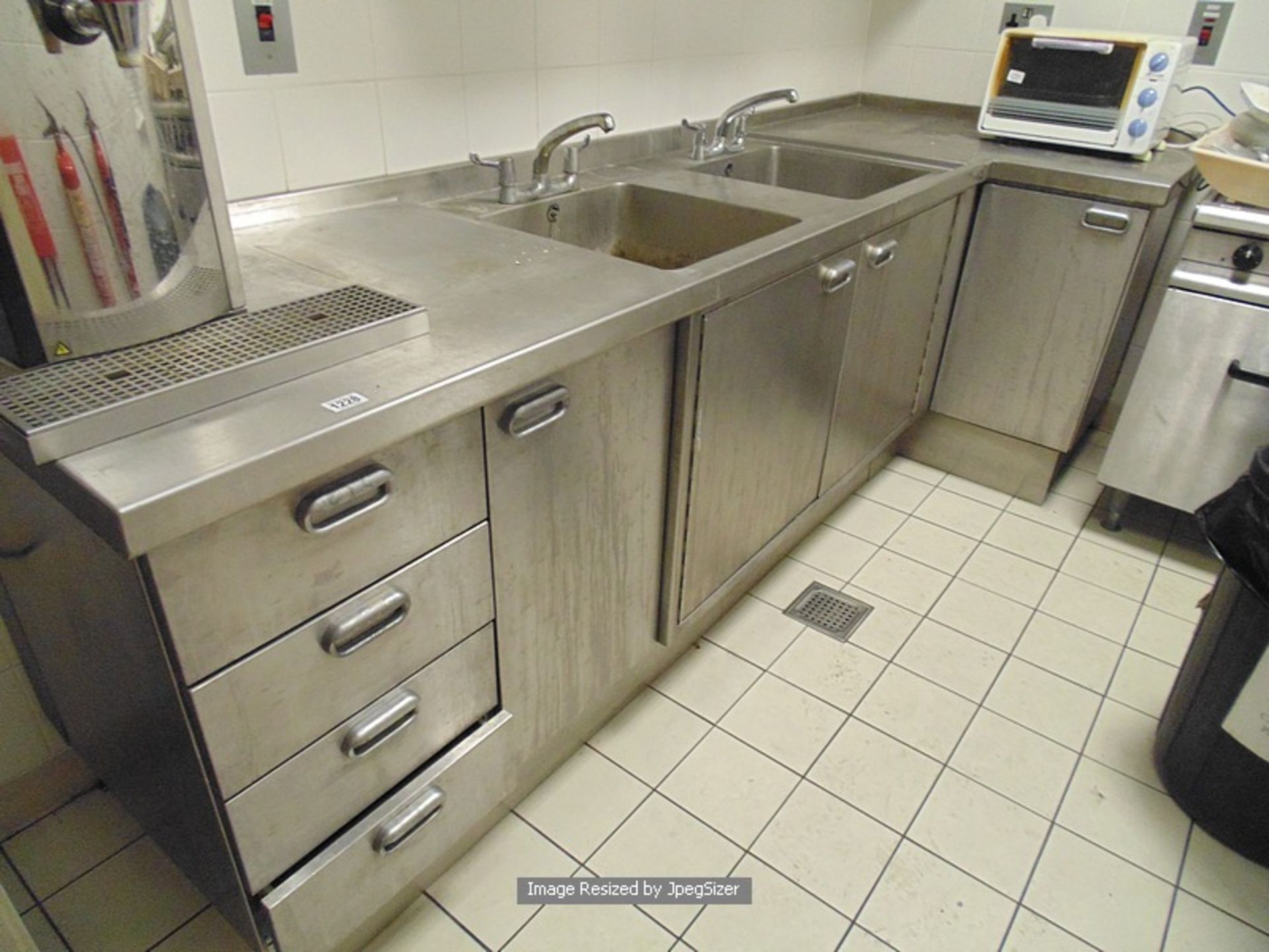 Moffat stainless steel L shaped kitchen workstation comprising of four drawer unit double bowl