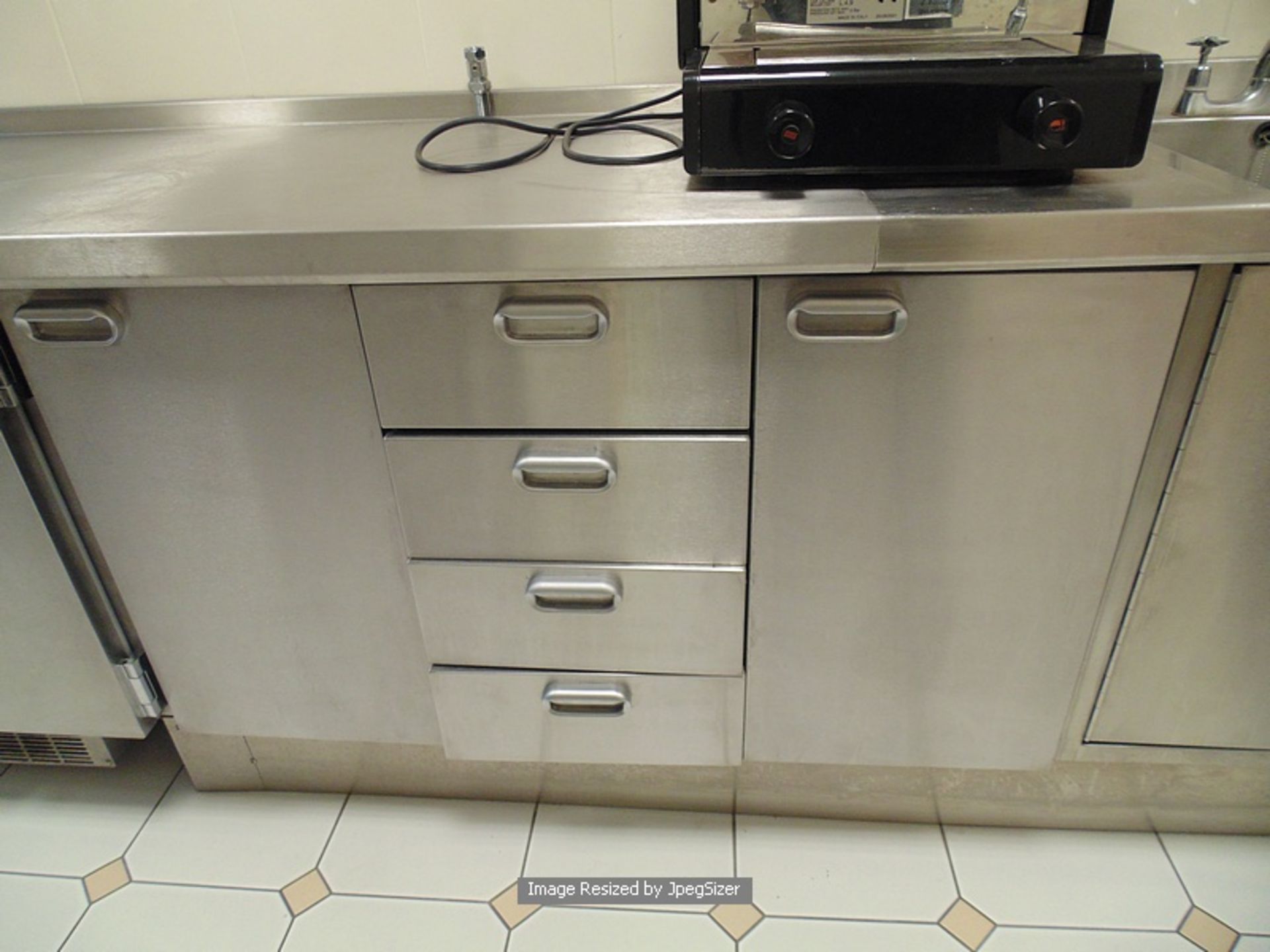 Moffat stainless steel workstation comprising of 3 x single door cupbards, 2 x 4 drawer storage