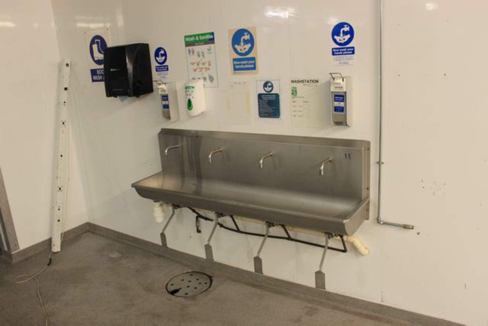 Stainless steel four station knee operated sink with soap and towel dispenser