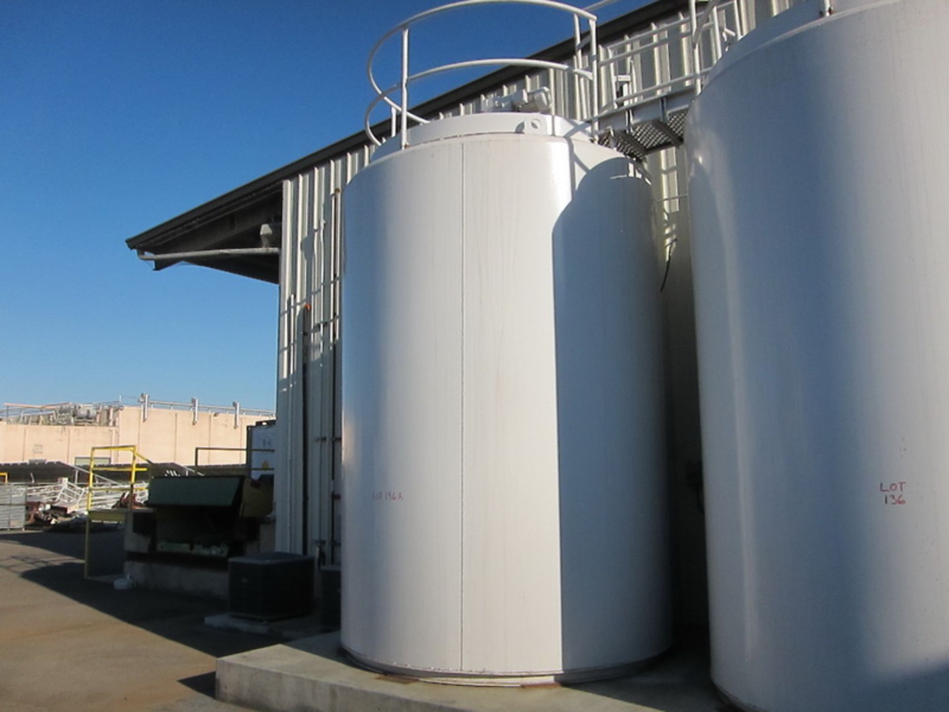 Feldmeier vertical blend tank, SS 4,000 gallon, slant bottom, insulated non-jacketed, with top