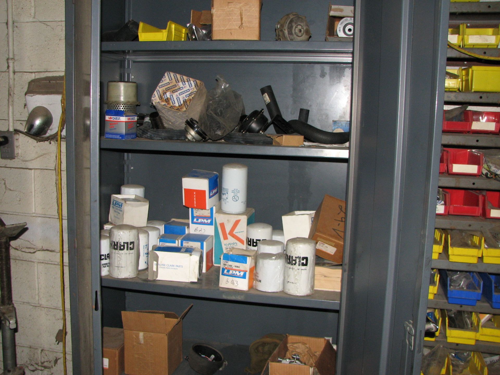 [Lot] Miscellaneous forklift parts, Nissan/Clark filters, plugs with storage cabinet and metal shelf - Image 2 of 2