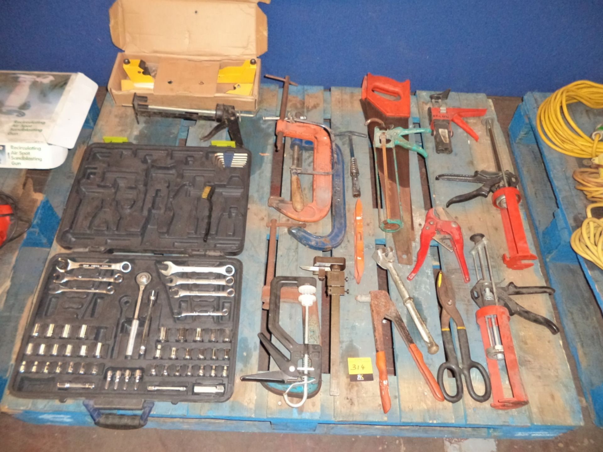 Contents of a pallet of assorted hand tools, clamps, tool kits and more