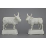 A pair of Dutch Delft monochrome white figures of cows, 18th C. Both naturalistically modelled on