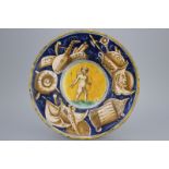 A Casteldurante maiolica plate with Cupid holding an arrow, dated 1560 Plate (Tagliere) of tin-