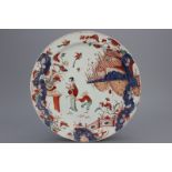 A large Dutch Delft doré chinoiserie plate in imari palette 18th C. Decorated with a lady (or