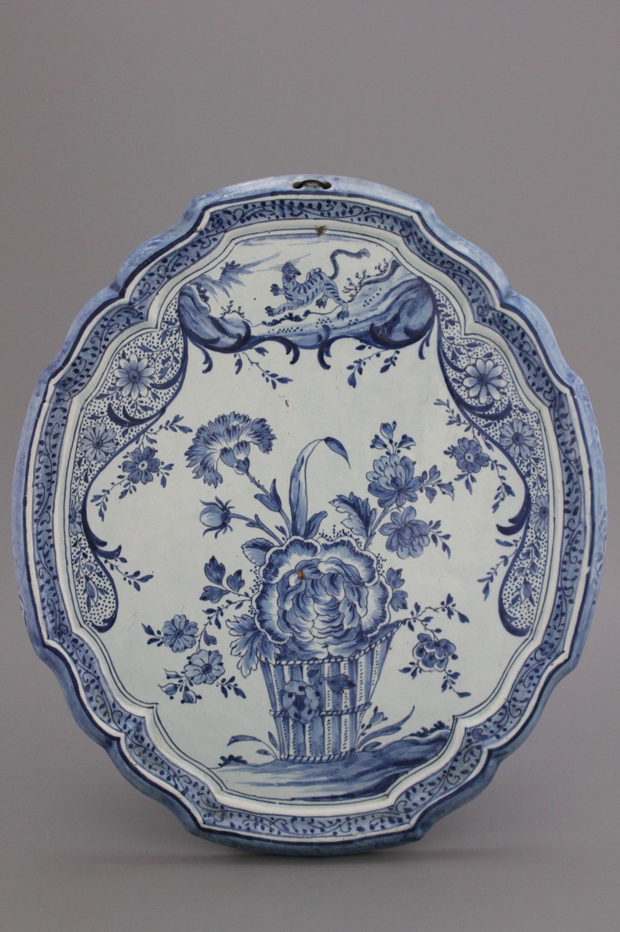 A Dutch Delft floral plaque 18th C. A fine blue and white Dutch Delft plaque with floral decoration,