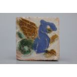 A Spanish olambrilla tile, Seville, first half 16th C. Decorated in relief with a winged horse in