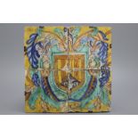 An armorial panel of 4 Seville tiles, ca. 1600 Vibrantly decorated in yellow, green, orange and