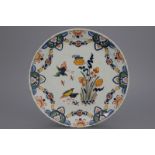 A polychrome Dutch Delft quail plate, early 18th C. Decorated with quails, a bird and insects