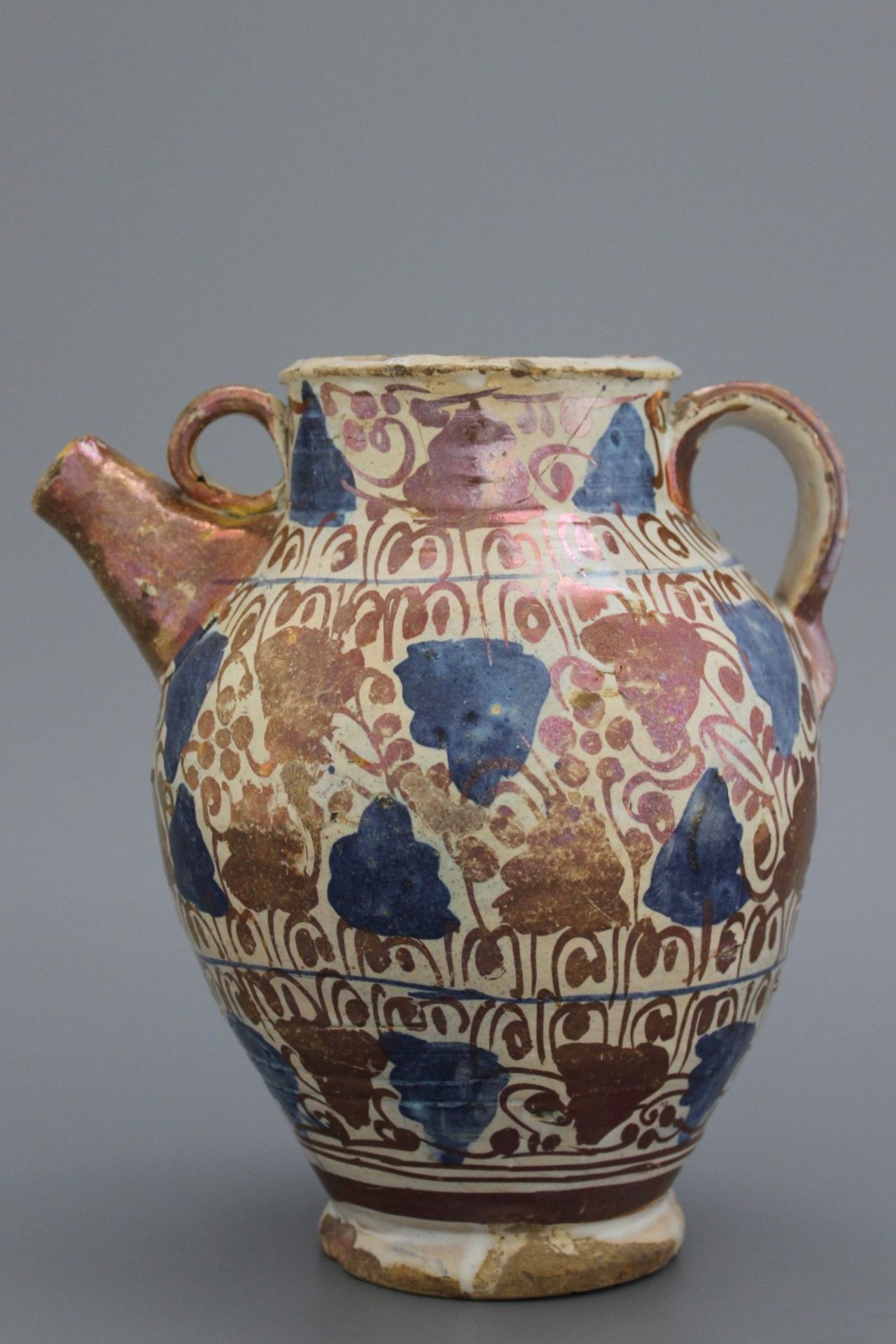 A Hispano-Moresque tin-glazed earthenware lustred wet drug jar, Manises, 15th C. The baluster formed