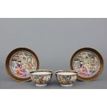 A pair of Chinese porcelain famille rose mandarin cups and saucers, Qianlong, 18th C. Fine