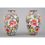 A pair of Chinese porcelain millefleurs black ground vases, ca. 1900 H: 12 cm. Perfect condition.