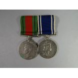 A WWII Defence Medal and Police Exemplary Service Medal to Sergt. Albert J. Day mounted as worn