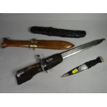 A Finnish M27 bayonet with scabbard, frog and blade marked 'Hackman & Co.' together with two