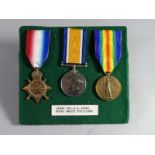 A WWI 1914-15 trio of medals to 14844 Cpl. R.R. Jones, R.W.F. pin-mounted onto green felt