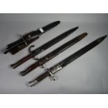 Four bayonets of the world with scabbards