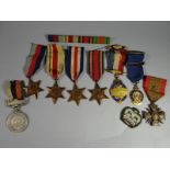 A grouping of eight medals and medallions to include WWII 1939-45, Africa, Burma and France &