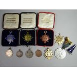 Eleven assorted medallions, some in boxes of issue and hallmarked silver and gold