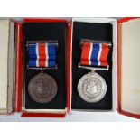 A Liverpool Police pair of silver and bronze medals with top ribbon bars in boxes of issue,
