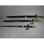 A French 1842 pattern bayonet together with a French Lebel bayonet with matching numbers and another