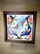 A framed Moorcroft pottery tile 'Tile of Smiles', 10 x 10 ins (25 x 25 cms)