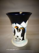 A Moorcroft pottery 'Penguins Family on Ice' flared neck vase, 6 ins high (16 cms)