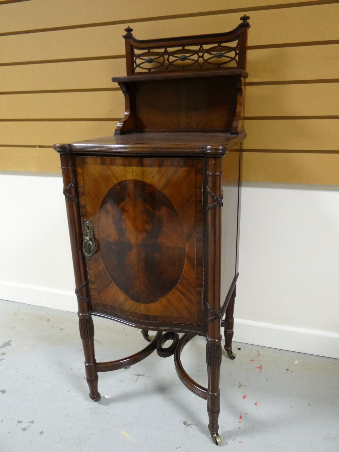 A late nineteenth century mahogany night-cabinet by Maple & Co, together with matching bed-ends