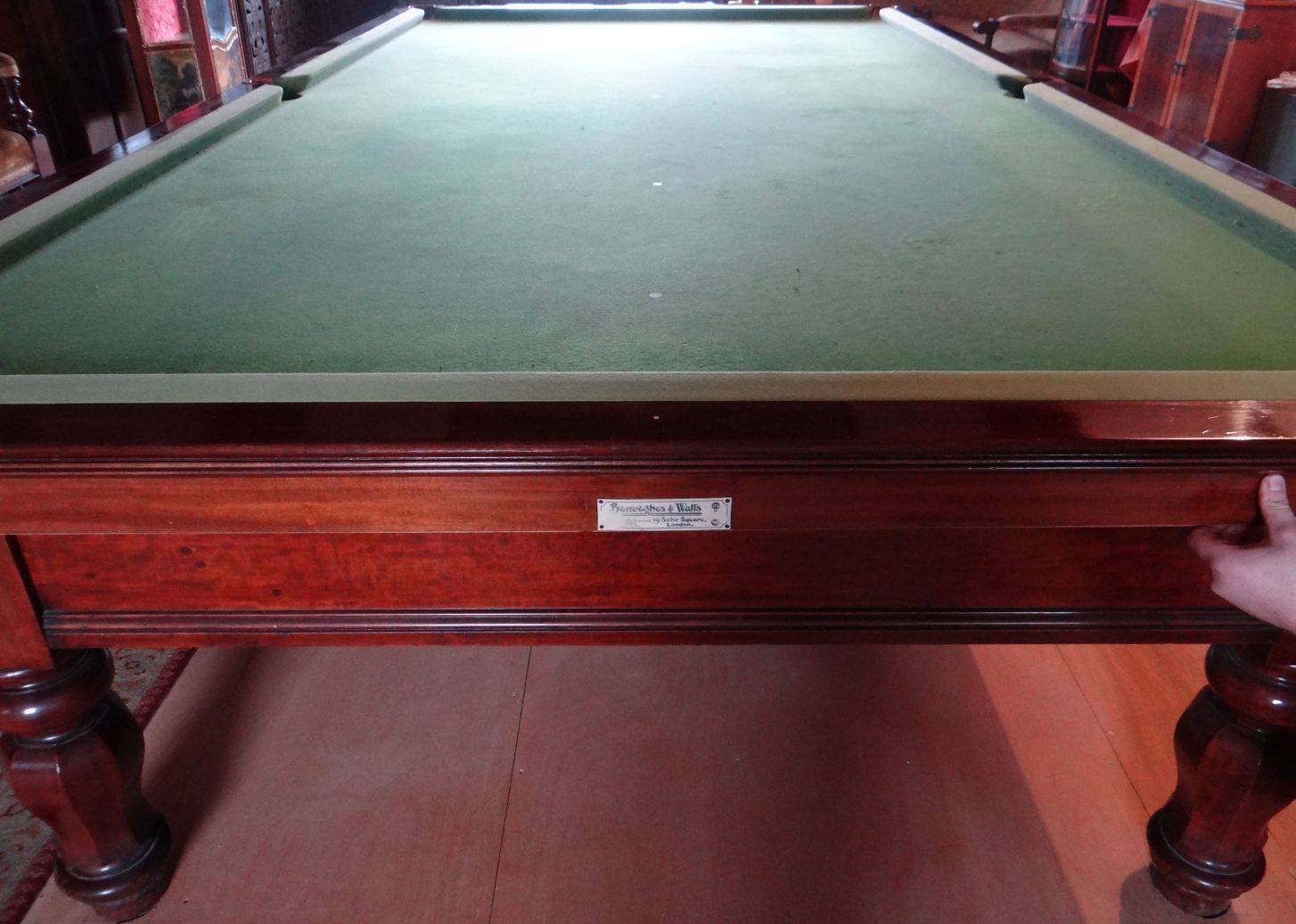 A Burroughes & Watts antique mahogany full-size snooker table, on eight turned and faceted supports,
