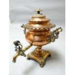 A good highly decorative heavy quality copper and brass samovar with domed lid and on shaped base